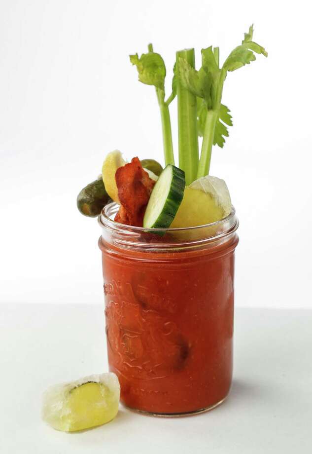 Pickle Juice Bloody Mary with dill pickle ice cubes photographed in the Houston Chronicle studio, Tuesday, July 9, 2019, in Houston. Pickle juice is a home cook's friend: it can be used as a marinade for fish and chicken, as a vinegar substitute, as a dressing for boiled potatoes, in barbecue sauces, in cocktails such as Bloody Marys and micheladas, in gazpacho, and to make pickle bread. And as every southerner knows, potato salad is better when made with pickle juice. Heck, even pickle popsicles. Photo: Karen Warren / Karen Warren / © 2019 Houston Chronicle