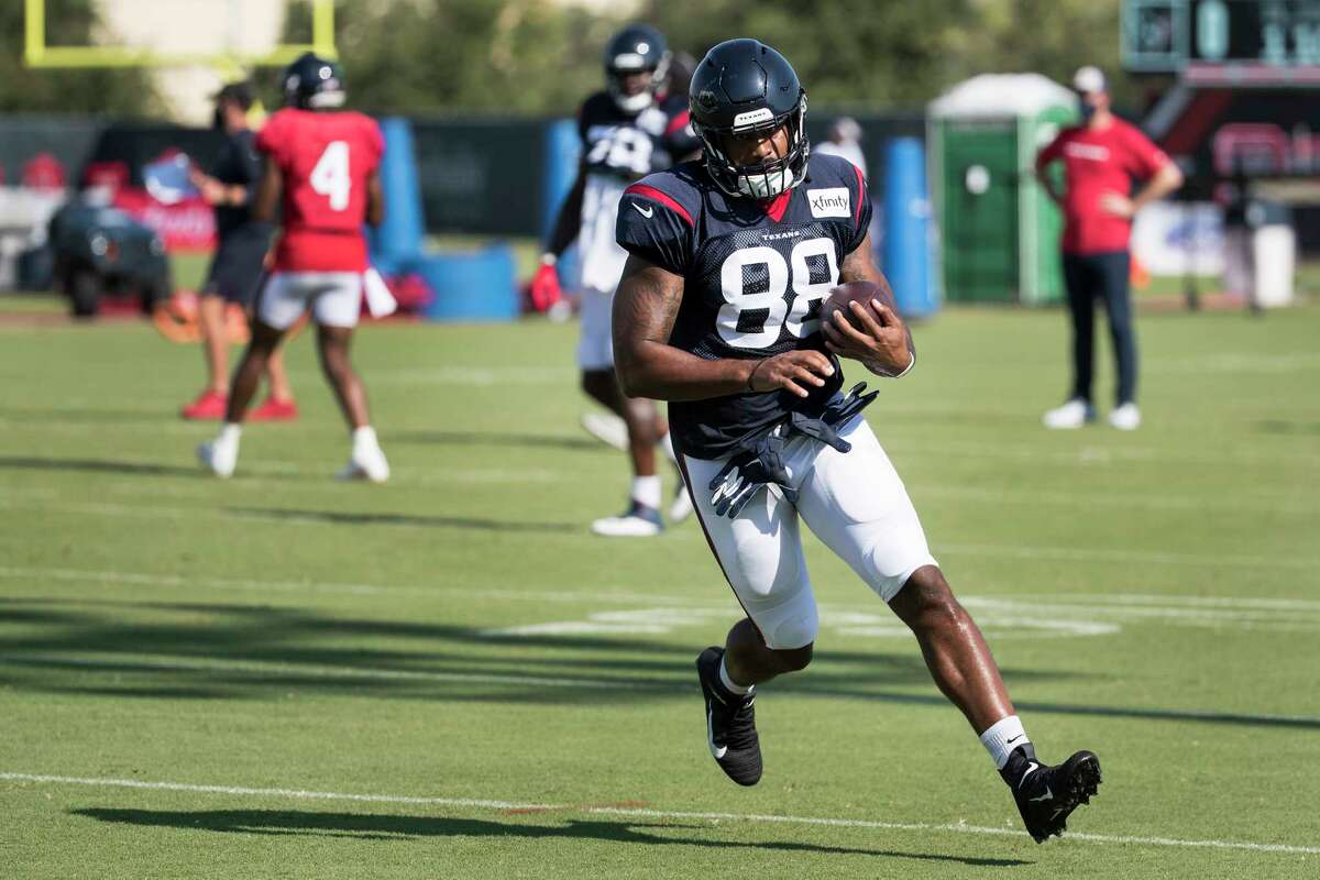 Houston Texans tight end Jordan Akins (88) turns upfield after making a catch during an NFL training camp football practice Thursday, Aug. 20, 2020, in Houston.