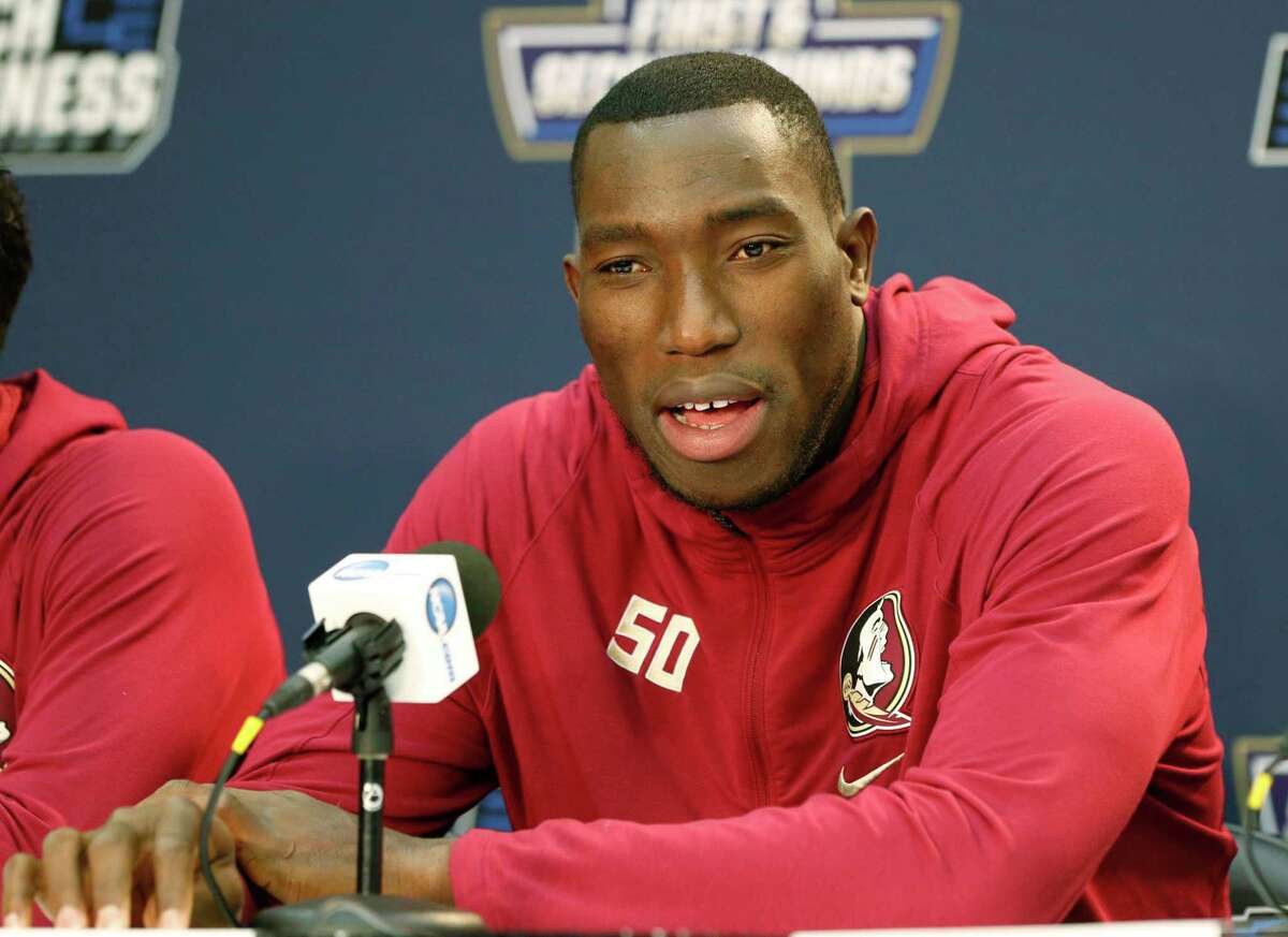 Former Florida State center Michael Ojo died from a heart attack earlier this month after collapsing during a workout. He had previously tested positive for COVID-19.