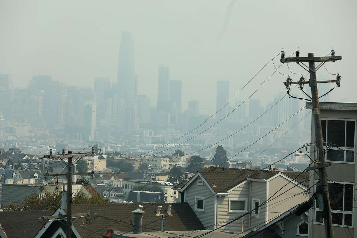 Wildfire smoke covers the skies seen looking toward downtown from 27th at Newburg streets on Wednesday, Aug. 19, 2020, in San Francisco, Calif.