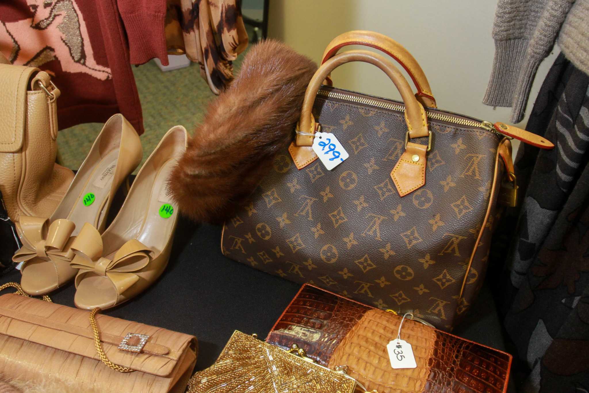 Vintage Chanel, Gucci and Burberry for sale at Salvation Army pop-up shop near Memorial ...