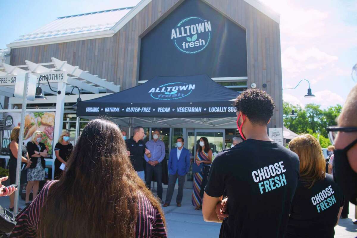 People gather for the grand opening of Alltown Fresh, a fresh convenience market, on Thursday, Aug. 20, 2020, in Schenectady, N.Y. This is the first Alltown Fresh store in New York State. The convenience market offers organic, natural, gluten-free, vegan, and vegetarian food options. (Paul Buckowski/Times Union)