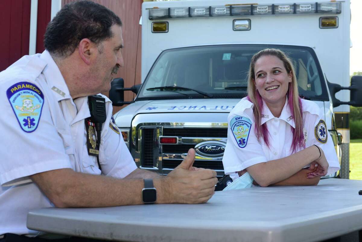 Paramedic Walter Hughes and his daughter EMT Kristina Hughes at Greenwich GEMS station 3 Wednesday, August 19, 2020, in Greenwich, Conn. Walter, a long-term employee of the Greenwich Emergency Medical Service, and his daughter, a recent addition to the team, collaborated on a resuscitation to safe a life last month.