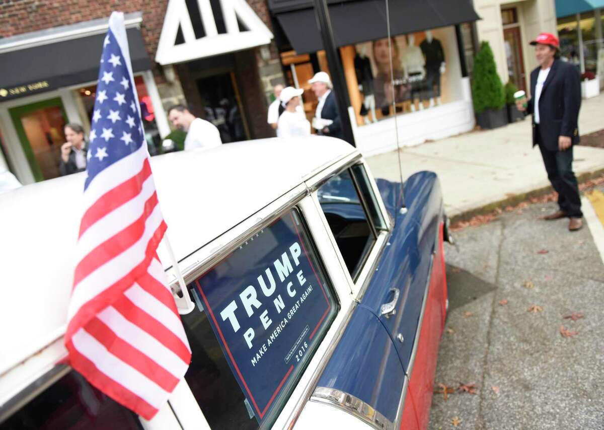 A Donald Trump sign is seen inside a Trump supporter’s car as former Connecticut gubernatorial candidate Joe Visconti stumps for Donald Trump with fellow Trump fans in downtown Greenwich on Nov. 3, 2016.