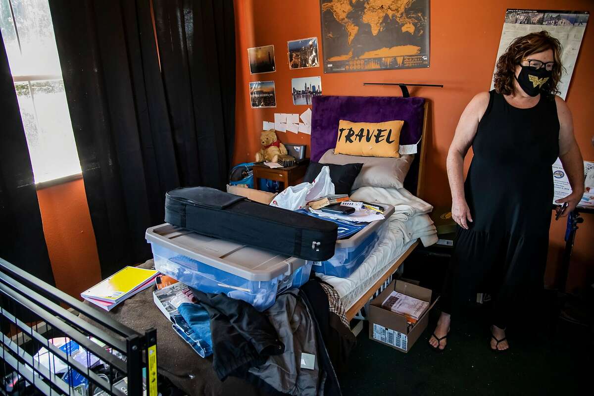 Michelle Rode-Smith stands in her son’s bedroom at their home in Clarksburg, Calif, on Monday, August 10, 2020. Seth Smith, a 19-year-old UC Berkeley student, was killed in Berkeley, Calif. on June 15, 2020. Two months and a $50,000 reward later, police still don't have a suspect and his traumatized parents are searching for answers as they help Seth's younger sister prepare to start college.