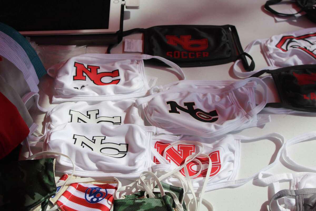Masks bearing the New Canaan High School logo were available at the 84 Sports booth at the "So Long to Summer Sale" on Elm Street in New Canaan, which continues from 9 a.m. to 5 p.m. Saturday, Aug. 22.