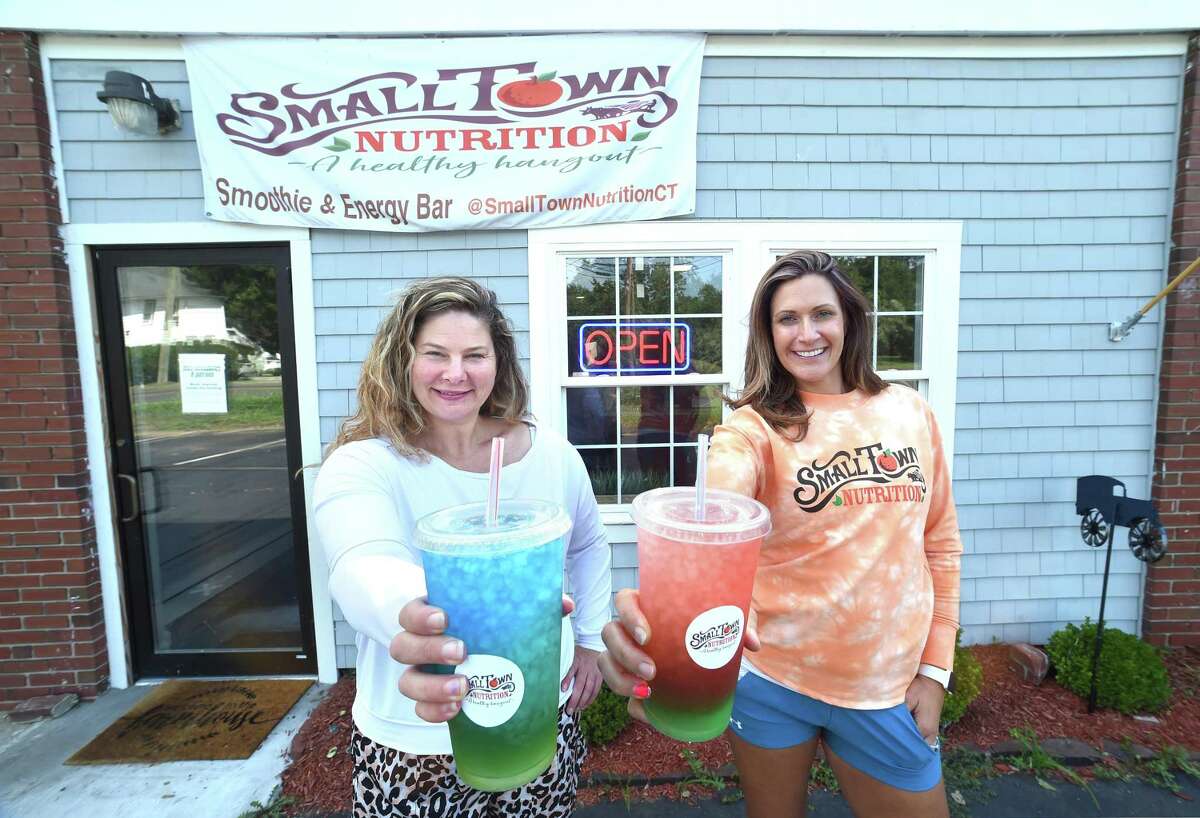 Tiffany Arsenault (left) and Maria Small, co-owners of Small Town Nutrition, are photographed outside of their new business on Orange Center Road in Orange on August 14, 2020.