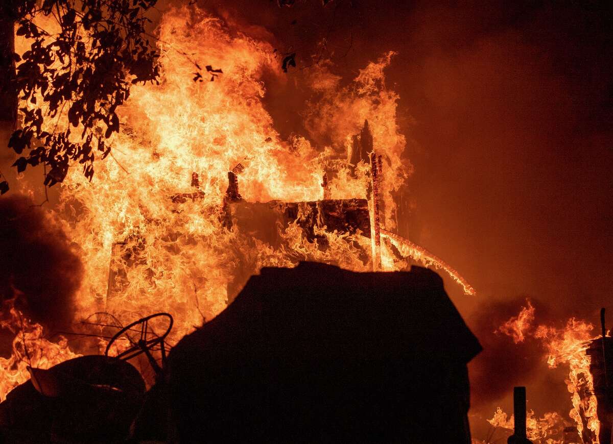 A structure burns Friday near Boulder Creek (Santa Cruz County).
