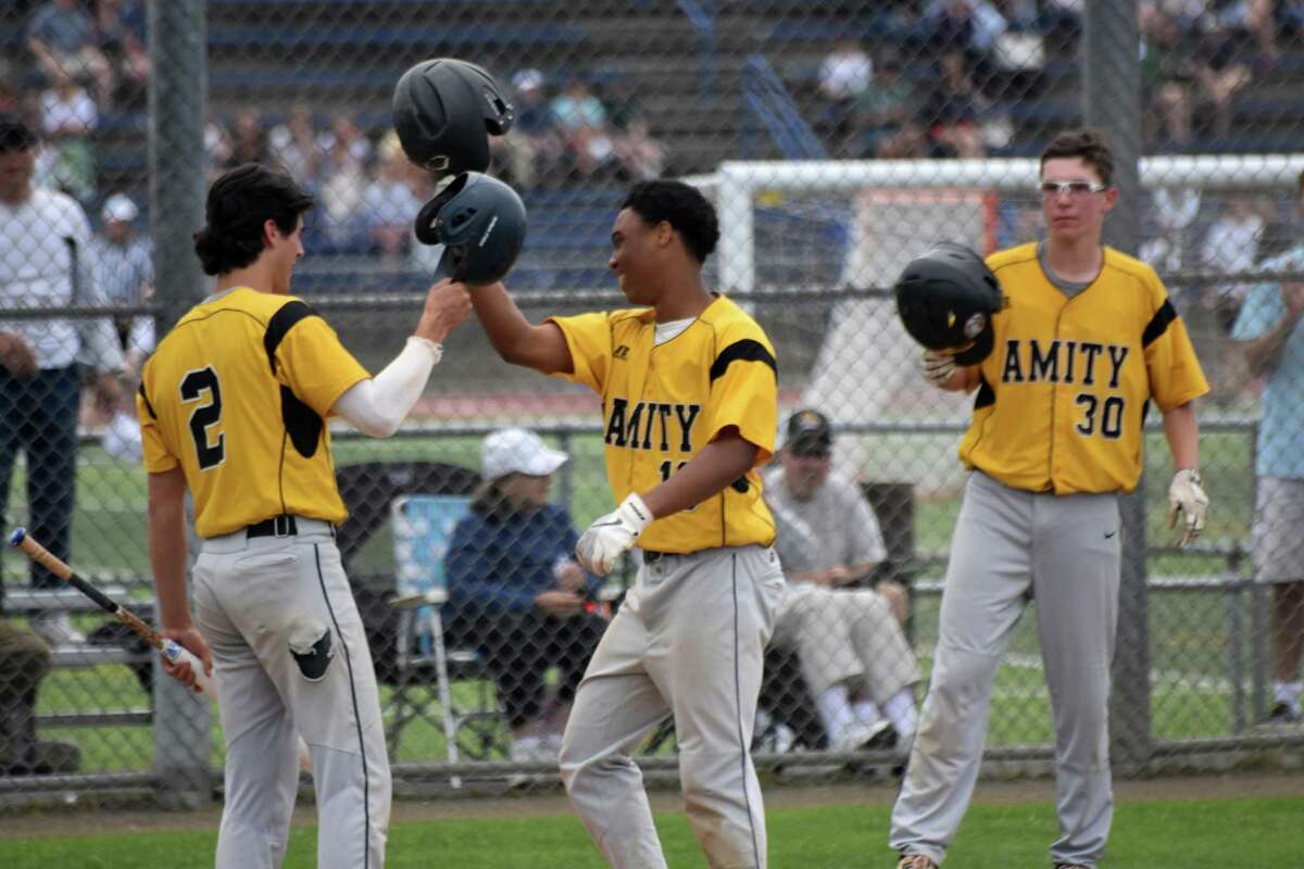 Amity’s Julian “JuJu” Stevens celebrates after hitting a home run in the 2019 SCC Championship game in West Haven.