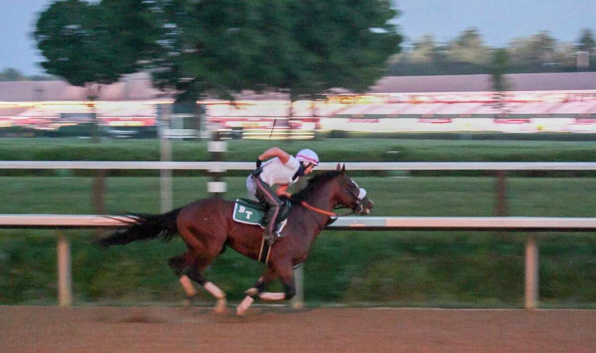 In the predawn hours where only the illumination from street lamps bathed the track Tiz the Law with exercise rider Heather Smullen aboard had one of his final preparatory works before the Kentucky Derby Sunday Aug.23, 2020 at the Saratoga Race Course in Saratoga Springs, N.Y. Photo by Skip Dickstein/Special to the Times Union