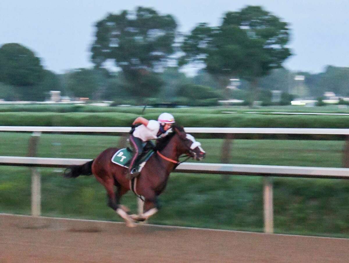 In the predawn hours where only the illumination from street lamps bathed the track Tiz the Law with exercise rider Heather Smullen aboard had one of his final preparatory works before the Kentucky Derby Sunday Aug.23, 2020 at the Saratoga Race Course in Saratoga Springs, N.Y. Photo by Skip Dickstein/Special to the Times Union