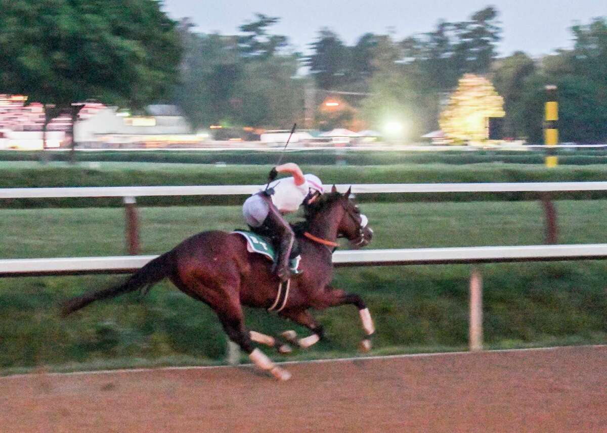 In the predawn hours where only the illumination from street lamps bathed the track Tiz the Law with exercise rider Heather Smullen aboard had one of his final preparatory works before the Kentucky Derby Sunday Aug.23, 2020 at the Saratoga Race Course in Saratoga Springs, N.Y. Photo by Skip Dickstein/Special to the Times Union