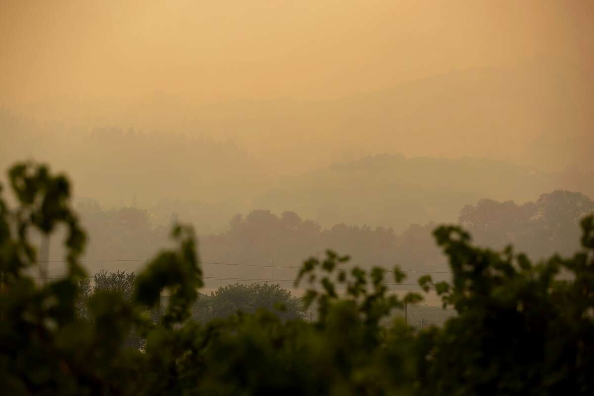 The hills opposite Dry Creek Road are barely seen through the smoke in Healdsburg, Calif. during the Walbridge fire on Saturday, August 22, 2020.