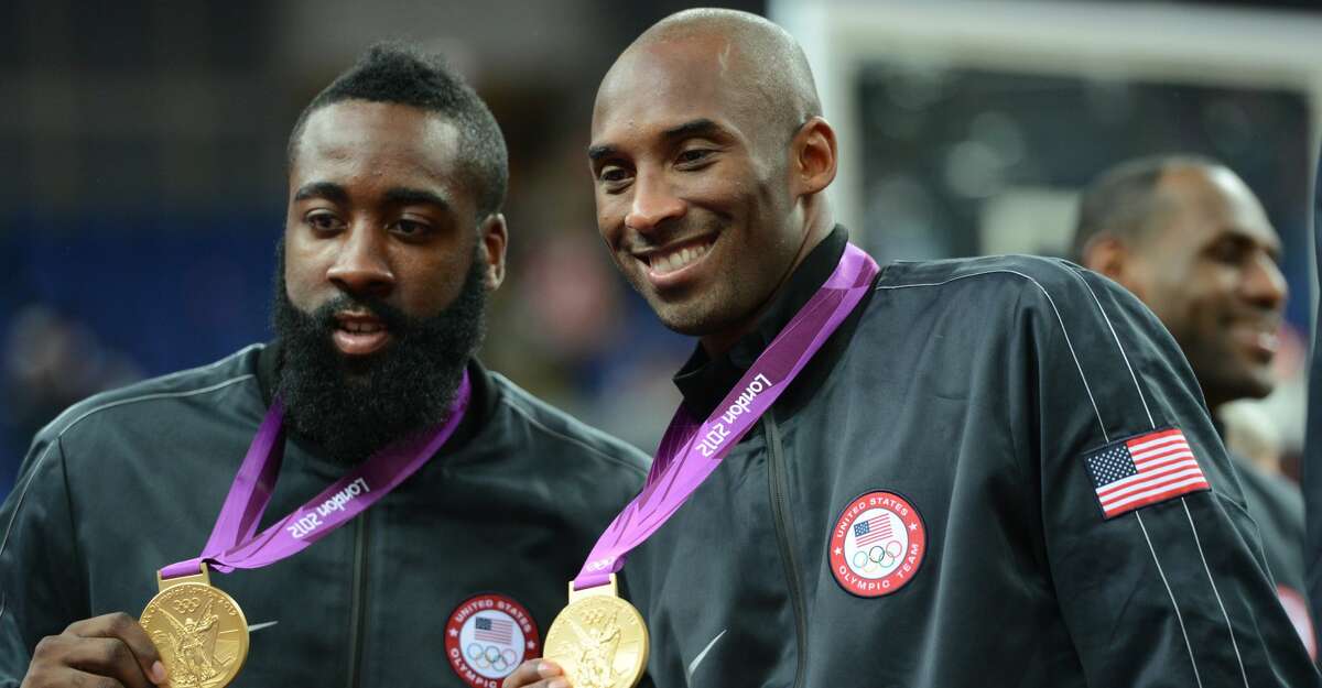 US guard Kobe Bryant (R) and US gard James Harden celebrate with their gold medal on the podium after the London 2012 Olympic Games men's gold medal basketball game between USA and Spain at the North Greenwich Arena in London on August 12, 2012.