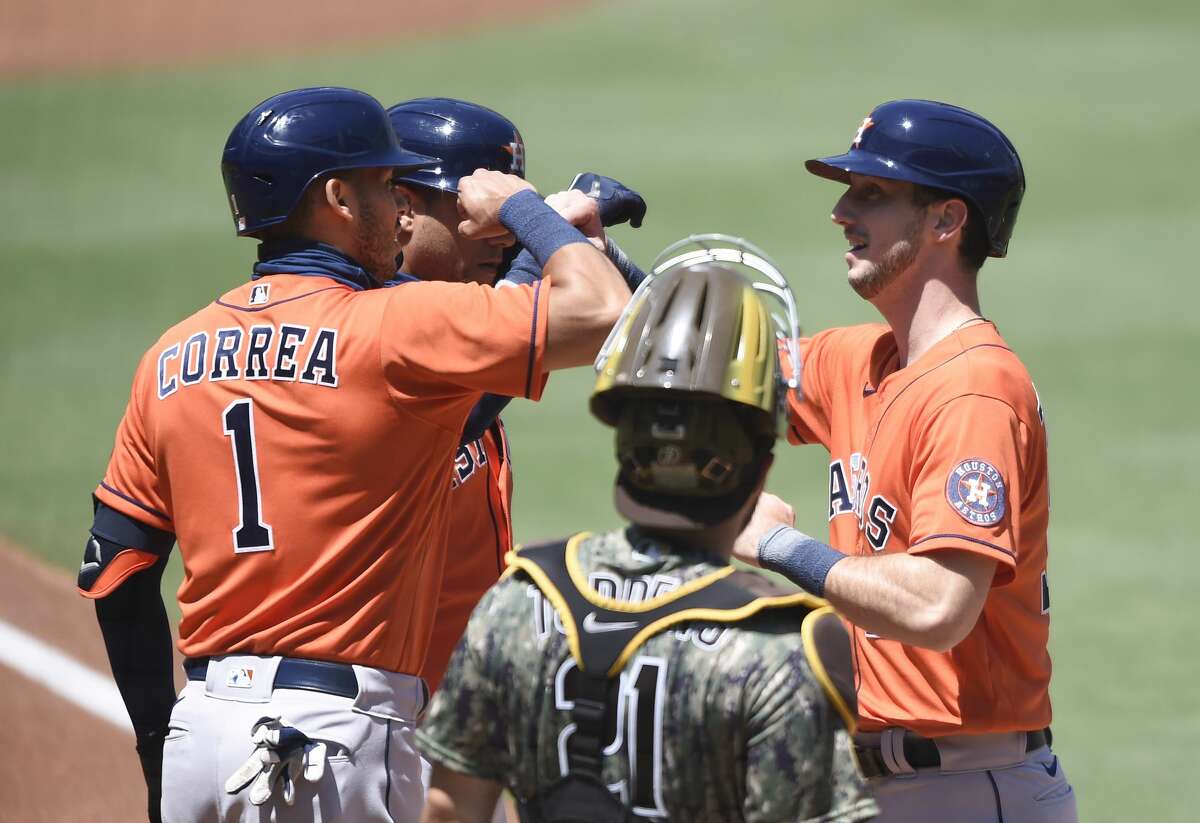SAN DIEGO, CA - AUGUST 23: Kyle Tucker #30 of the Houston Astros, right, is congratulated by Carlos Correa #1 after hitting a two-run home run during the first inning of a baseball game against the San Diego Padres at Petco Park on August 23, 2020 in San Diego, California. (Photo by Denis Poroy/Getty Images)