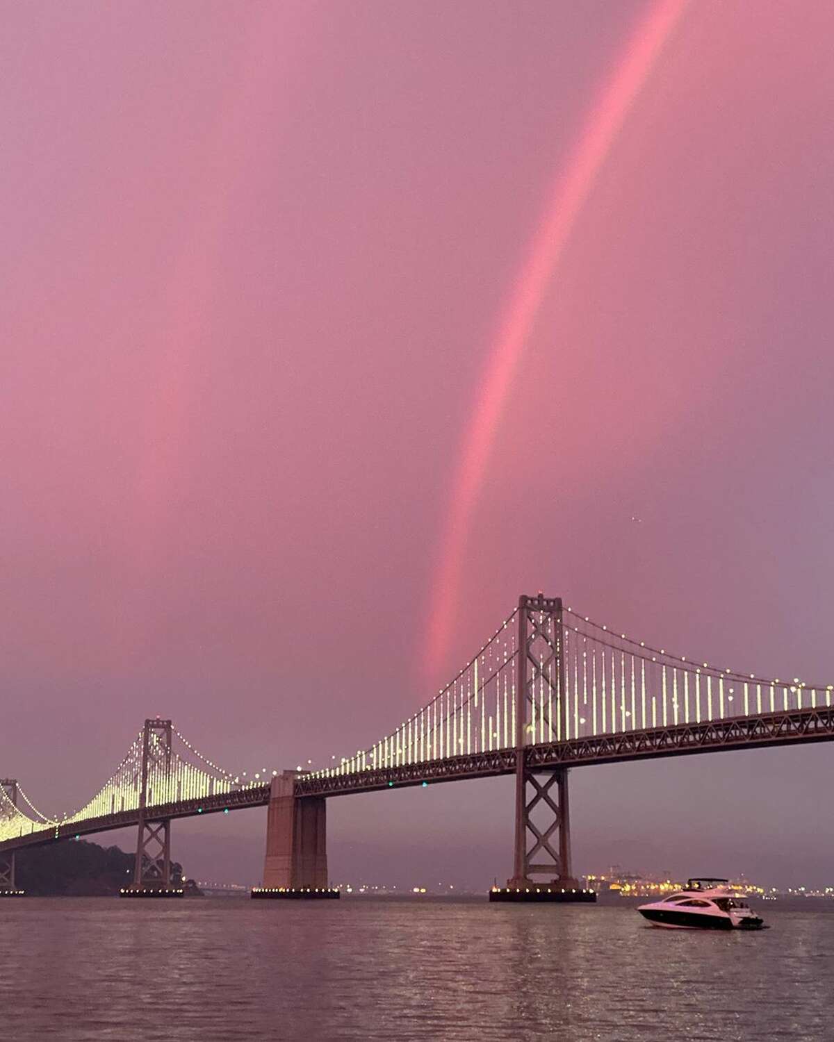 An apparent double rainbow during sunset over the Bay Bridge on Sunday, Aug. 23, 2020, as wildfires raged across California.  (Photo: fashionablya / Instagram )