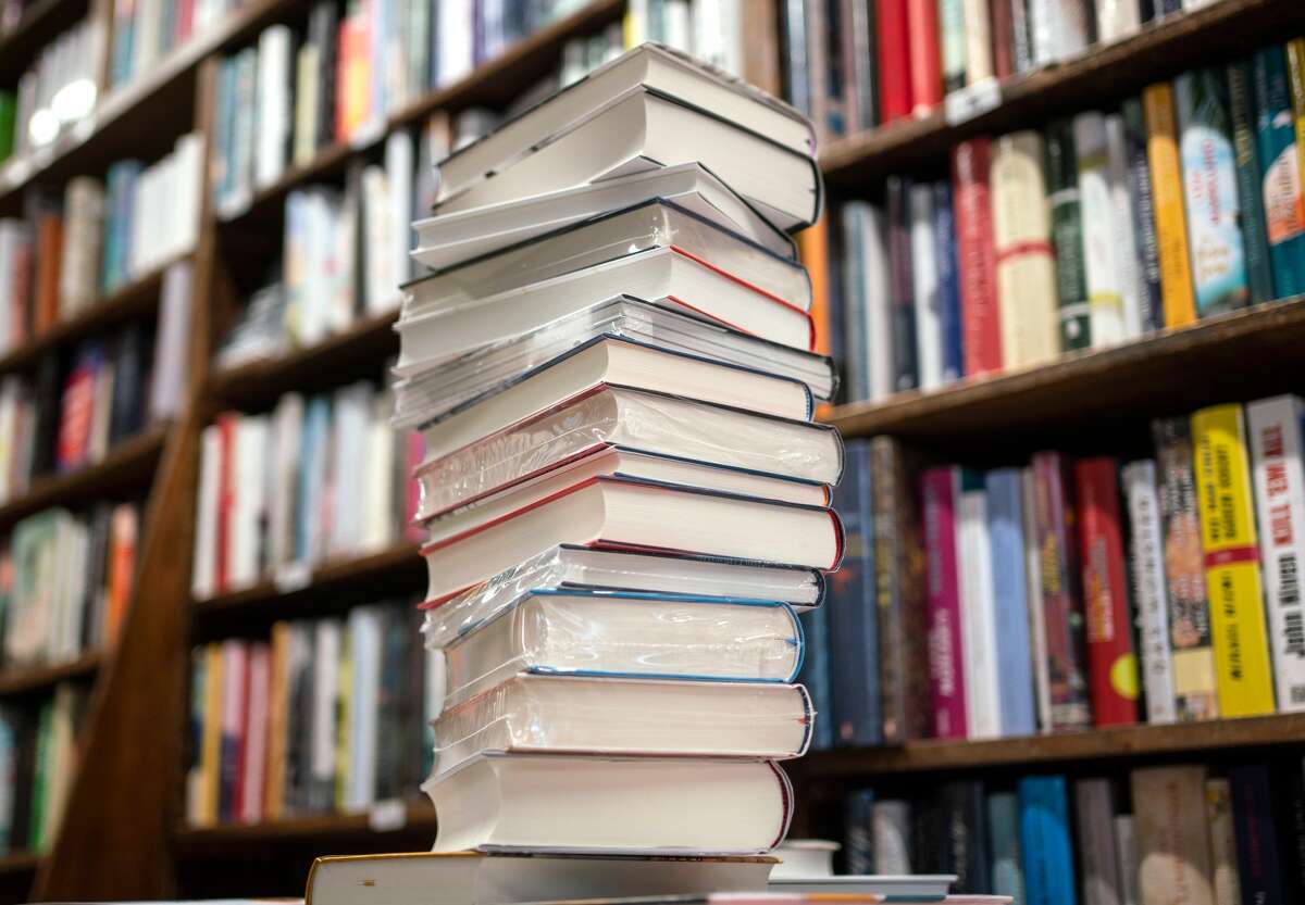 FILE—A stack of books in a library.