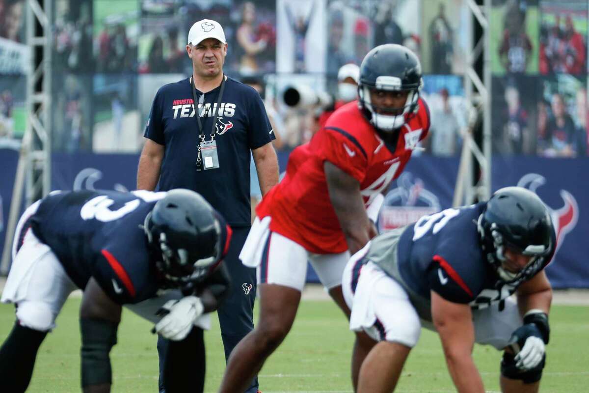 Houston Texans head coach Bill O'Brien looks on as quarterback Deshaun Watson (4) lines up under center during an NFL training camp football practice Monday, Aug. 24, 2020, in Houston.