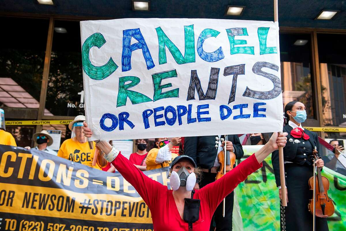 Renters and housing advocates attend a protest to cancel rent and avoid evictions in front of the court house amid Coronavirus pandemic on August 21, 2020, in Los Ageles, California. (Photo by VALERIE MACON / AFP) (Photo by VALERIE MACON/AFP via Getty Images)