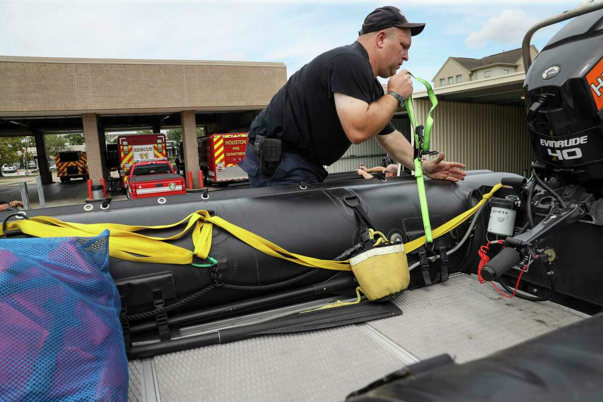 Houston Firefighter Paul Kessler prepares water-rescue equipment Monday, Aug. 24, 2020, at HFD Station 11 in Houston. Tropical weather systems are expected to hit Texas and Louisiana later in the week.