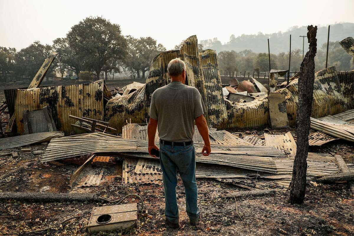 David Hill looks over the charred remains of his property after the LNU Lightning Complex fire tore through the area on Monday, Aug. 24, 2020 in Vacaville, California. David has owned the property since 1981 and built the property himself.