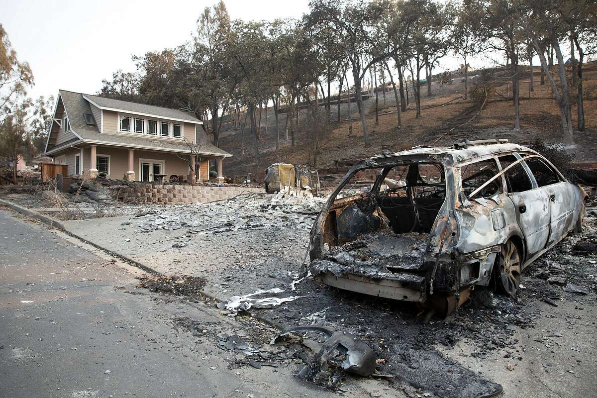 A single unburned house stands next to the remains of the house next to it in the Berryessa Highlands neighborhood near Lake Berryessa, Calif. on Monday, August 24, 2020. The area was recently devastated by the LNU Complex fire that was started by lightning on August 16.