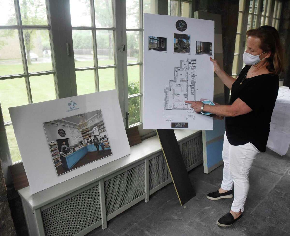 Coffee for Good Executive Director Deb Rogan shows plans and renderings of the Coffee for Good site in Greenwich, Conn. Wednesday, Aug. 19, 2020. The non-profit coffee shop will provide jobs for people with disabilities and serve as a platform to train people with disabilities for success in the local workforce. Coffee for Good is expected to open in February of 2020 in the historic 1858 Mead House next to Second Congregational Church.