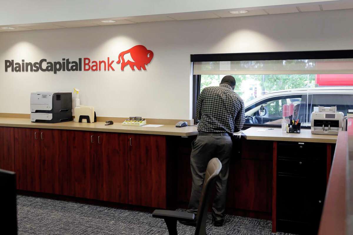 Teller manager Alfred Matthews at the drive up window at the new branch of the PlainsCapital Bank Tuesday, Aug. 25, 2020 in The Woodlands, TX.