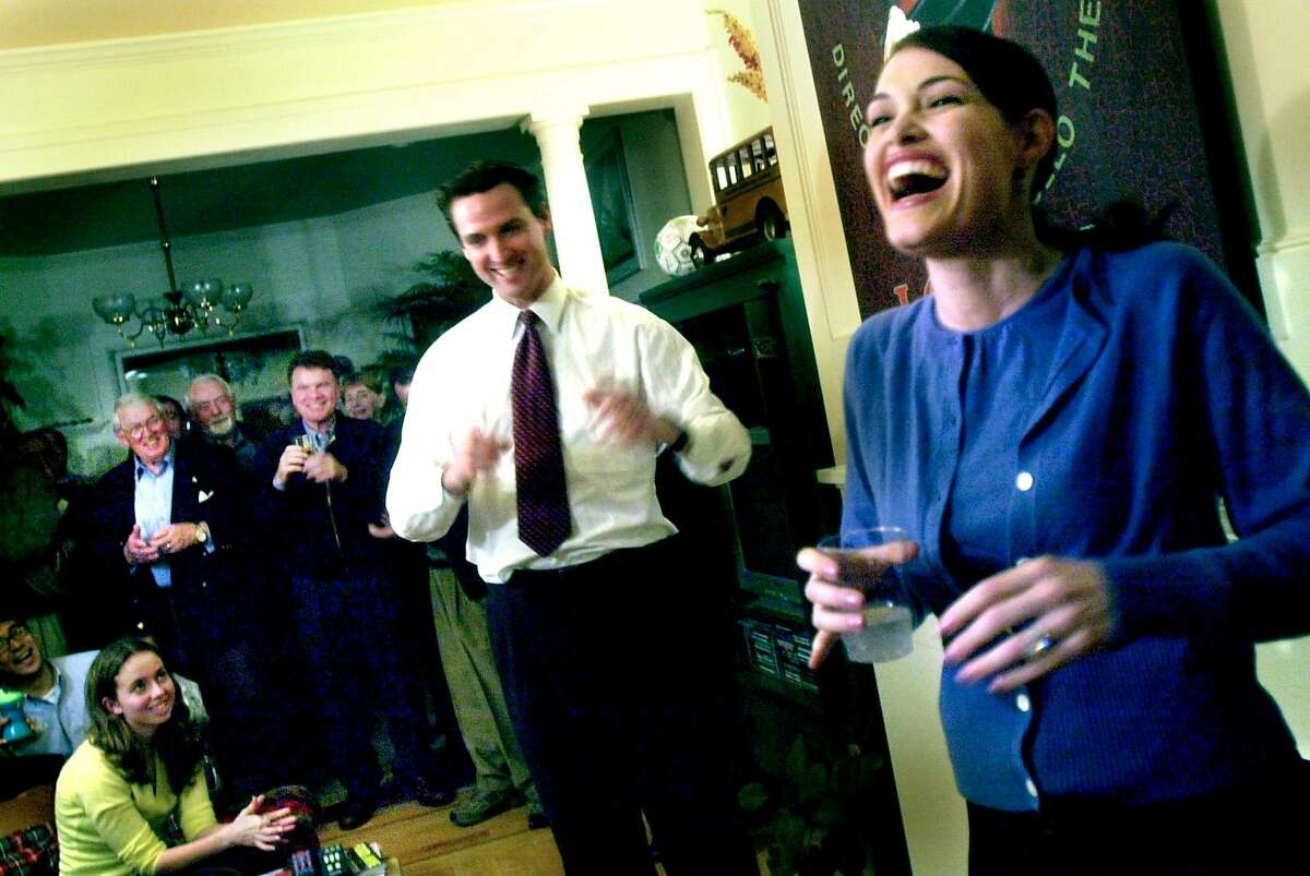 NEWSOMk-C-09JAN03-MT-CKH CHRISTINA KOCI HERNANDEZ/CHRONICLE Supervisor Gavin Newsom with his wife (R), Kimberly Guilfoyle Newsom, at a campaign fund-raising party thrown for him in Noe Valley.