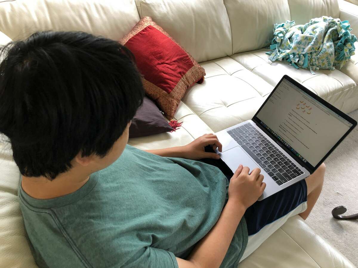 Tutor Max Hsu(CVHS 10th grader) preparing lesson material.