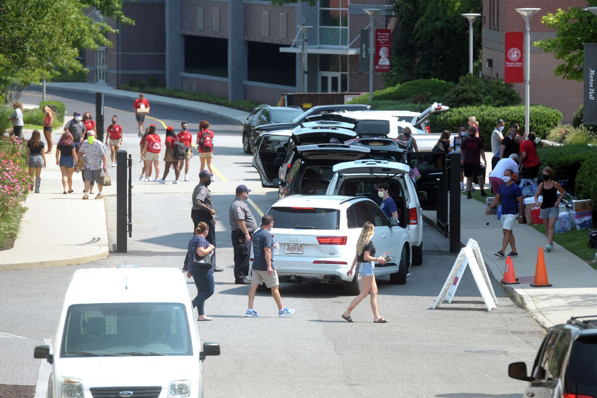 Freshmen arrive on the campus of Sacred Heart University, in Fairfield, Conn. Aug. 25, 2020.