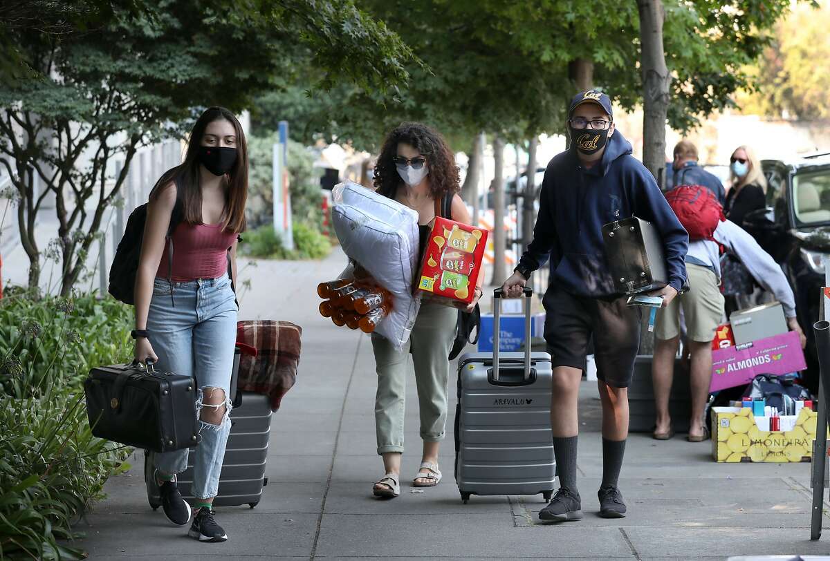 Sister Zylah Arevalo (left) and mother Leslie Arevalo help Sebastian Arevalo, 17, move into his dorm at UC Berkeley in August.