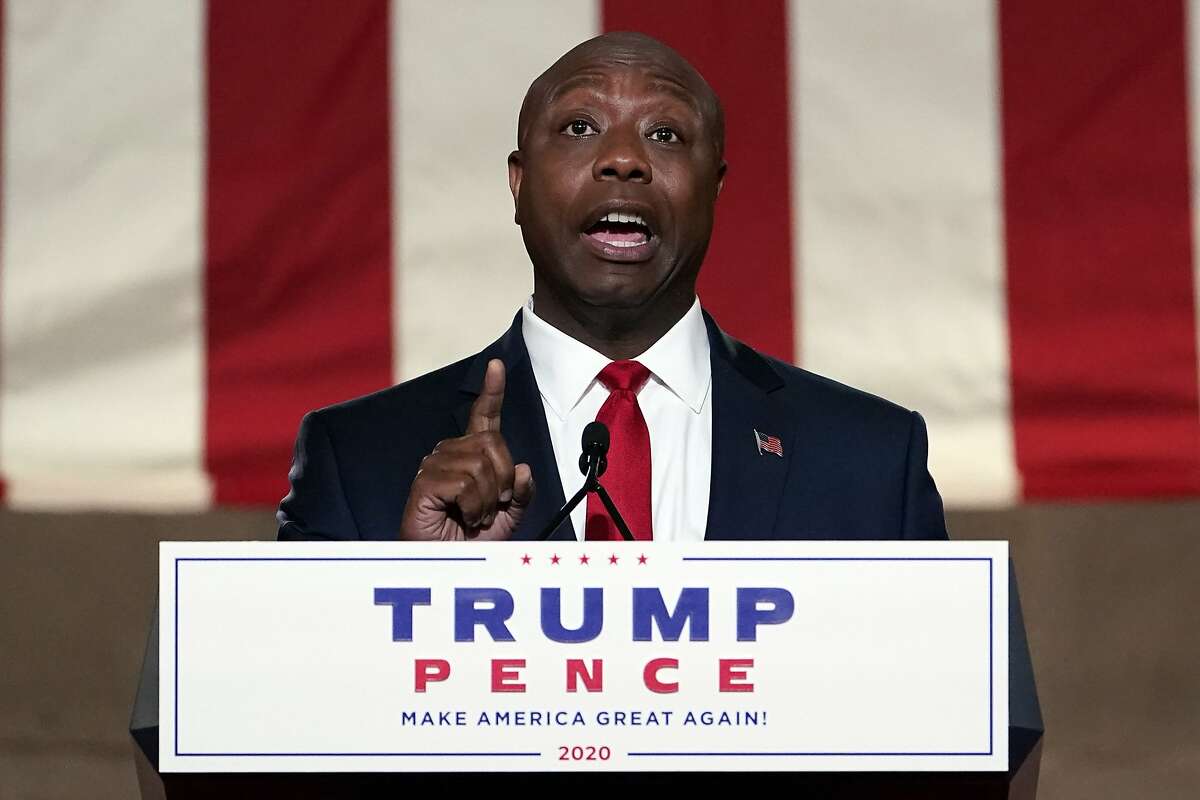 Sen. Tim Scott, R-S.C., speaks during the first night of the Republican National Convention from the Andrew W. Mellon Auditorium in Washington, Monday, Aug. 24, 2020. (AP Photo/Susan Walsh)