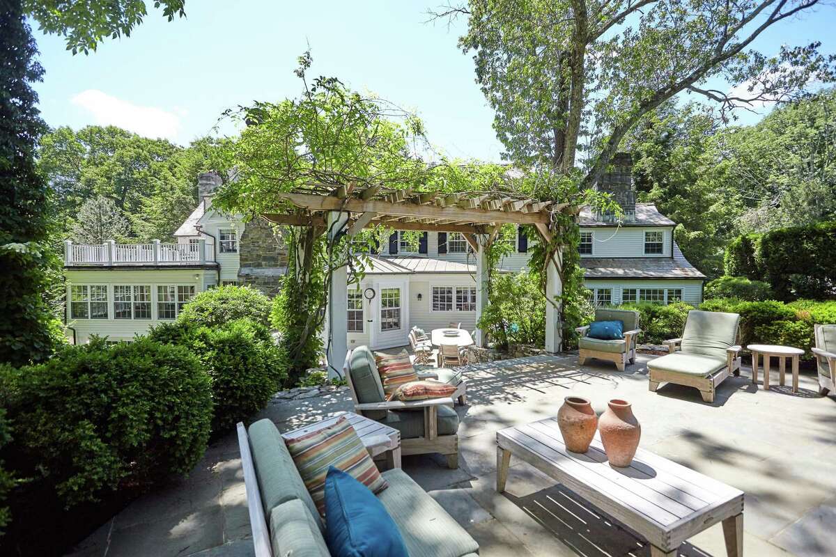 This property invites indoor-outdoor living with multi-level stone patios. The 155-acre sanctuary surrounds the Connecticut Audubon Society's Center at Fairfield on Burr Street, which runs parallel to this part of Congress Street. The two roadways intersect in another area. The Audubon Society website says this sanctuary is one of its largest and most widely used. It contains a great variety of habitats and wildlife, and it features seven miles of trails that include the Chiboucas wheelchair-accessible trail for the disabled. It also features hundreds of species of songbirds as well as several types of owls. A brochure with a self-guided hike is available at the Audubon Center.