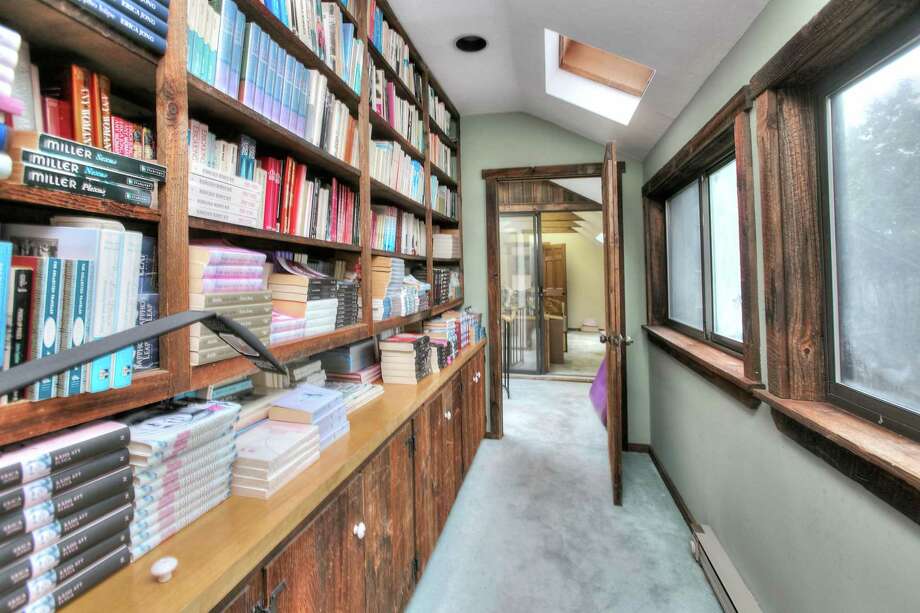 Considering the literary giant who has called this house “home” for so many years, it’s not surprising that many of the rooms throughout feature built-in bookshelves. Photo: Contributed / Higgins Group Bedford Square