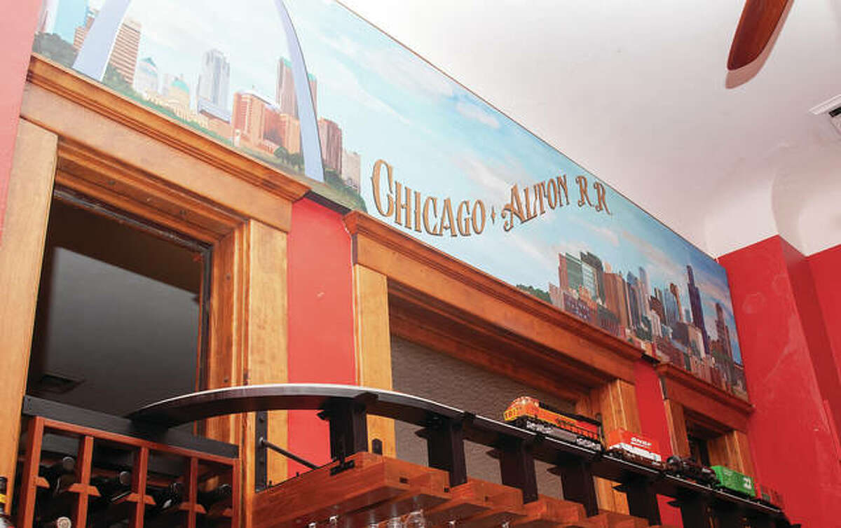 Dru Fernandes painted a mural for Lonzerotti’s Italia Restaurant showing the endpoint cities of the passenger train route that used to stop in Jacksonville. In addition to the mural, owner Frank Whitney built tracks for a moving model train set.
