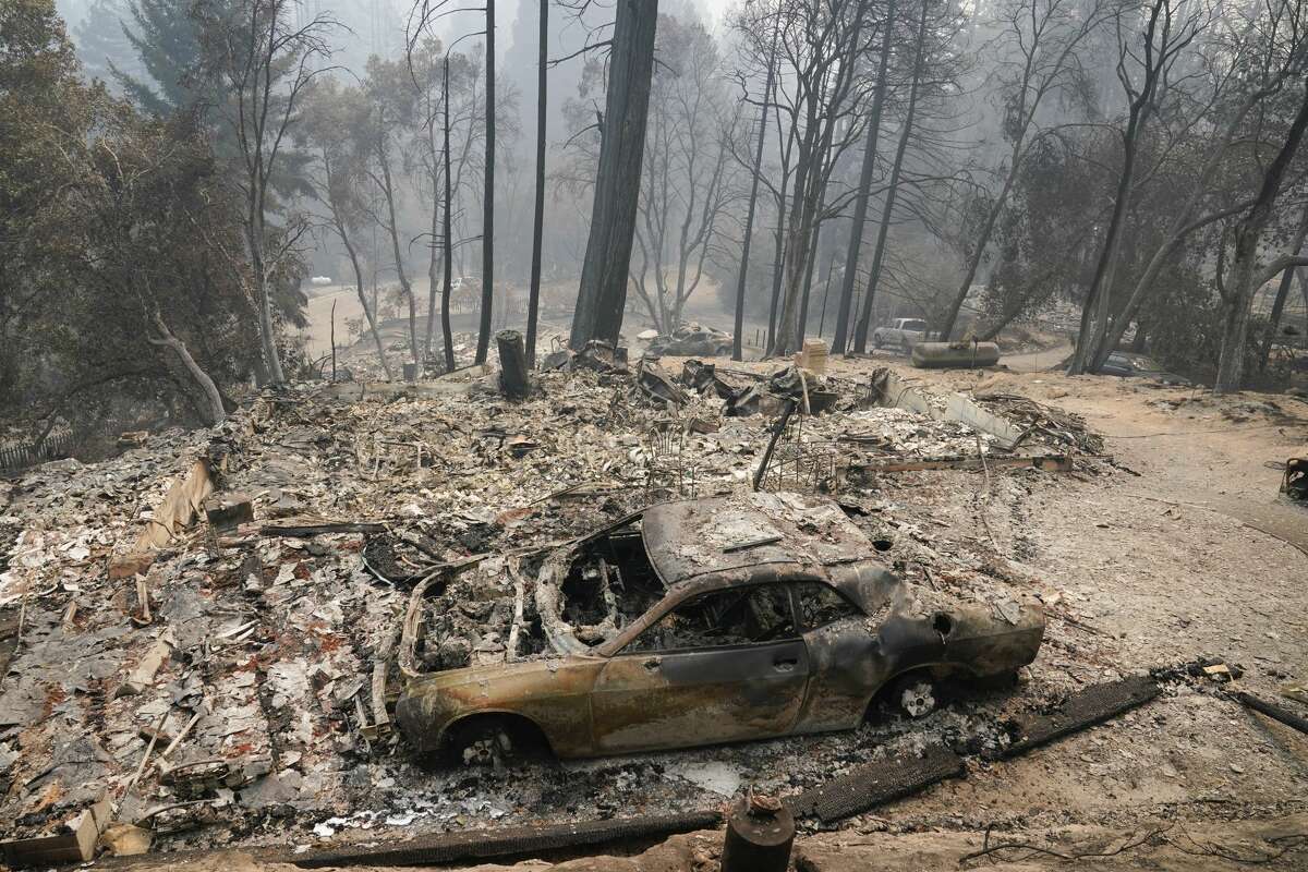 A fire-ravaged neighborhood is seen Tuesday, Aug. 25, 2020, in Boulder Creek, Calif., after the the CZU August Lightning Complex Fire passed by.