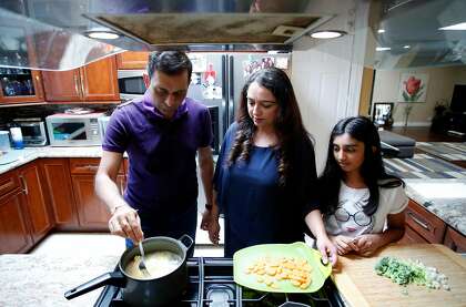 (Left-right) Rahul and Richa Kapoor, who were brought together through an arranged marriage, prepared a late lunch for their daughter Kashish Kapoor, at their home in San Jose, California, on Saturday, August 15, 2020.