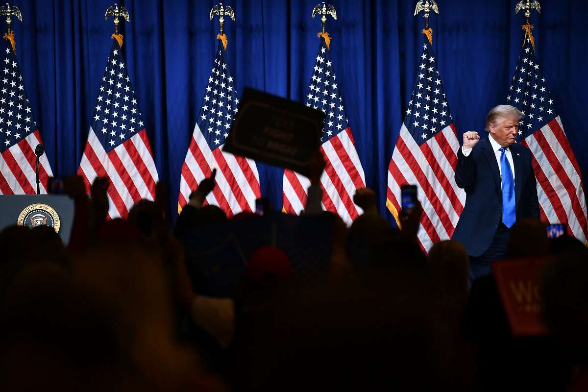 TOPSHOT - US President Donald Trump speaks as delegates gather during the first day of the Republican National Convention on August 24, 2020, in Charlotte, North Carolina. - President Donald Trump went into battle for a second term Monday with his nomination at a Republican convention where he will draw on all his showman's instincts to try and change the narrative in an election he is currently set to lose. (Photo by Brendan Smialowski / AFP) (Photo by BRENDAN SMIALOWSKI/AFP via Getty Images)