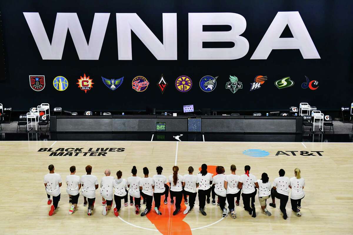 After the WNBA announced that Wednesday’s games were postponed, Washington Mystics players each wear white T-shirts with seven bullet holes on the back protesting the shooting of Jacob Blake by Kenosha, Wis., police, at Feld Entertainment Center in Palmetto, Fla.