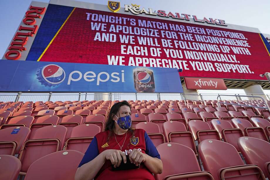 A lone fan fan sits in the stands in Sandy, Utah, after Wednesday night’s game between Real Salt Lake and Los Angeles FC was postponed. Photo: Rick Bowmer / Associated Press