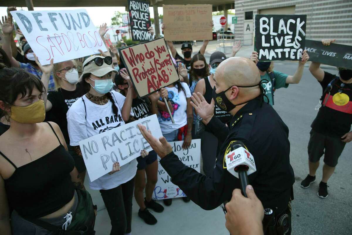 Bexar County Sheriff Javier Salazar attempts to talk with a group gathered in protest outside the county jail, Wednesday, Aug. 26, 2020. The group was protesting the Tuesday shooting death of Damian Lamar Daniels by deputies.