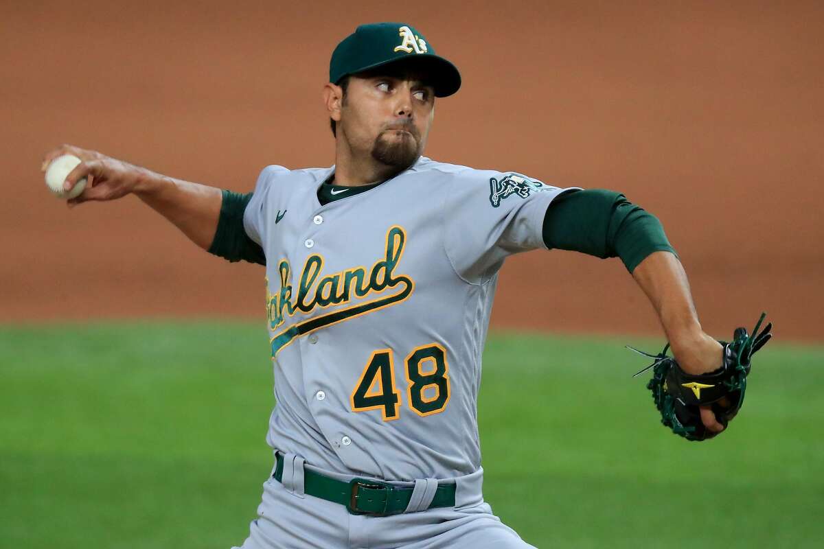 ARLINGTON, TEXAS - AUGUST 26: Joakim Soria #48 of the Oakland Athletics pitches against the Texas Rangers in the bottom of the seventh inning at Globe Life Field on August 26, 2020 in Arlington, Texas. (Photo by Tom Pennington/Getty Images)
