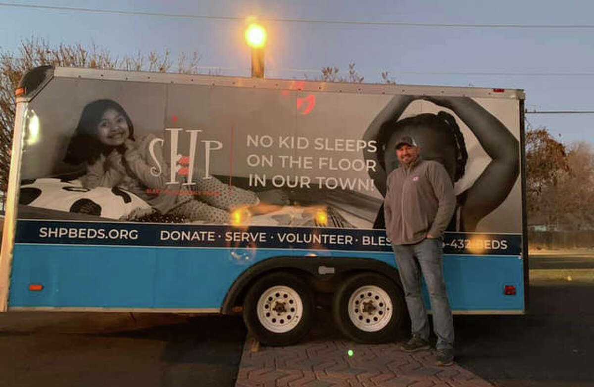 Jason Brunaugh, president of the Alton Chapter of Sleep in Heavenly Peace, a national organization supplying beds to kids in need, is pictured next to the group’s trailer. The volunteer group is planning its next work session for Saturday in Alton. For more details, visit the group’s Facebook page.