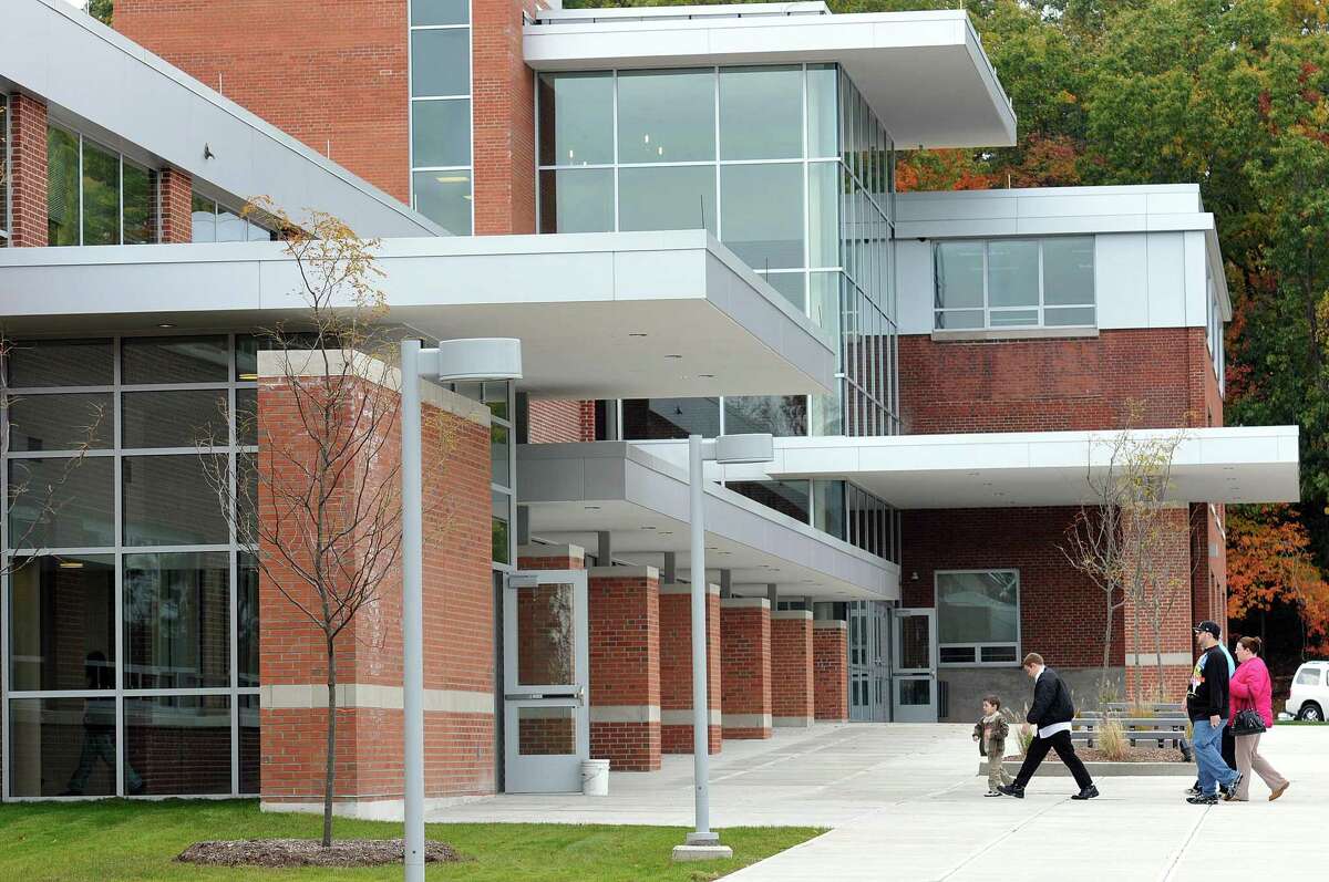 Cas101024 10/24/10 Shelton-- People walk into the front entrance at Perry Hill School for the addition and alterations project dedication ceremony. -Photo/Peter Casolino ***