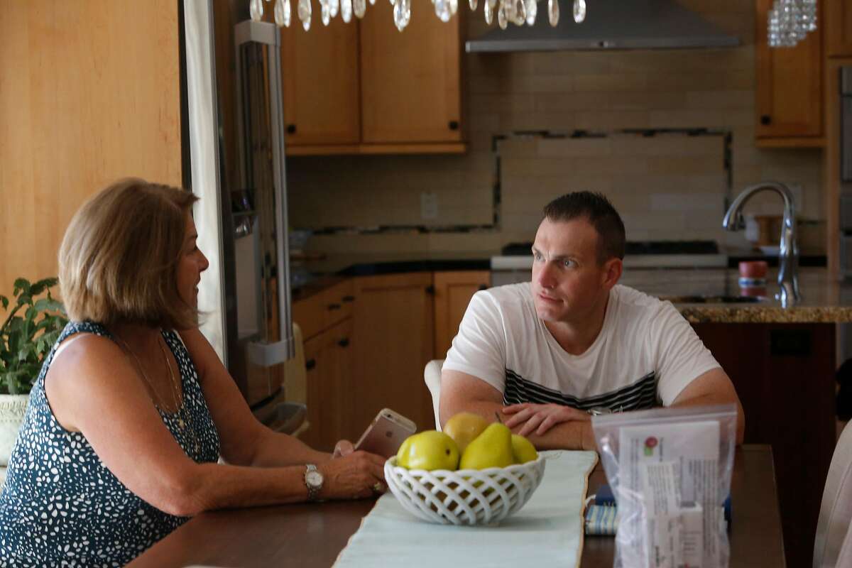 Jeffrey Choate (right) and his mother Sue Choate Brye (left) talk as they sit in the dining room at their home on Tuesday, August 11, 2020 in Clayton, Calif.