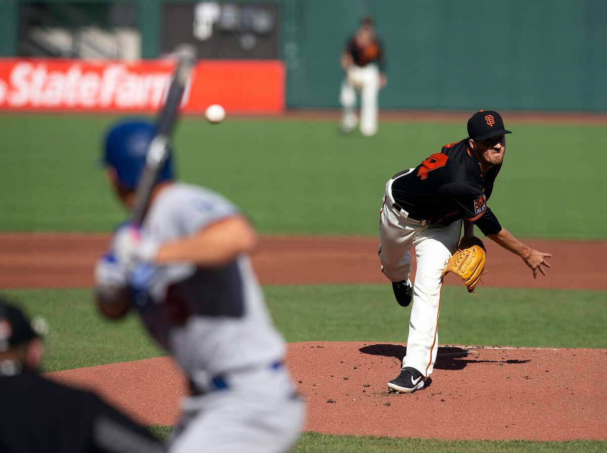 San Francisco Giants starting pitcher Kevin Gausman (34) delivers a pitch against the Los Angeles Dodgers during the first inning of a baseball game on Thursday, Aug. 27, 2020 in San Francisco, Calif.