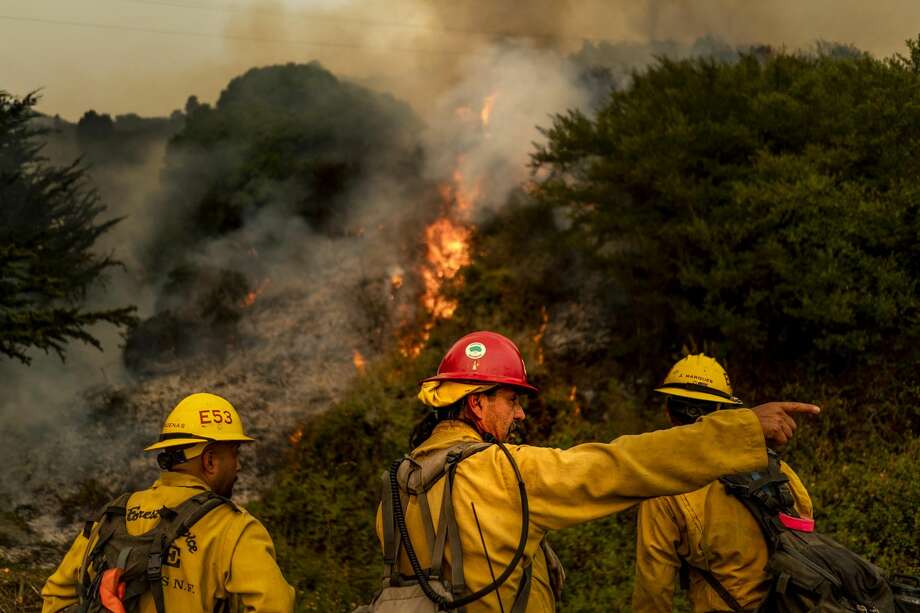 Battling the Dolan Fire along the central California coast, Los Padres National Forest fire fighters implement a "back-fire" method to burn off underbrush to protect residential structures in Big Sur. Photo: The Washington Post/The Washington Post Via Getty Im / 2020 The Washington Post