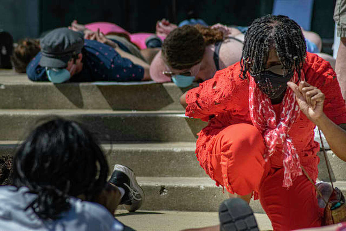 In this June 2020 file photo, a community member takes a knee amongst more than 700 residents on the steps during a peaceful protest at the Madison County Administration Building and Madison County Courthouse. Protests like these sparked the formation of two community action groups — on city governance and policing — in Edwardsville.