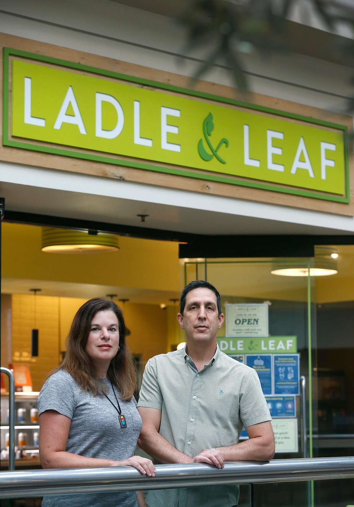Business partners Jennifer Sarver and Steve Sarver prepare their Ladle and Leaf cafe and restaurant for lunch service in the Crocker Galleria mall in San Francisco, Calif. on Tuesday, Aug. 25, 2020. Some businesses have remained open despite few office workers and commuters populating the Financial District during the coronavirus shutdown.
